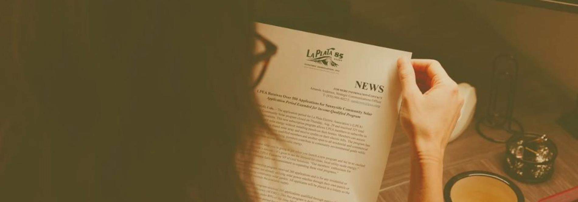 person reading a news release