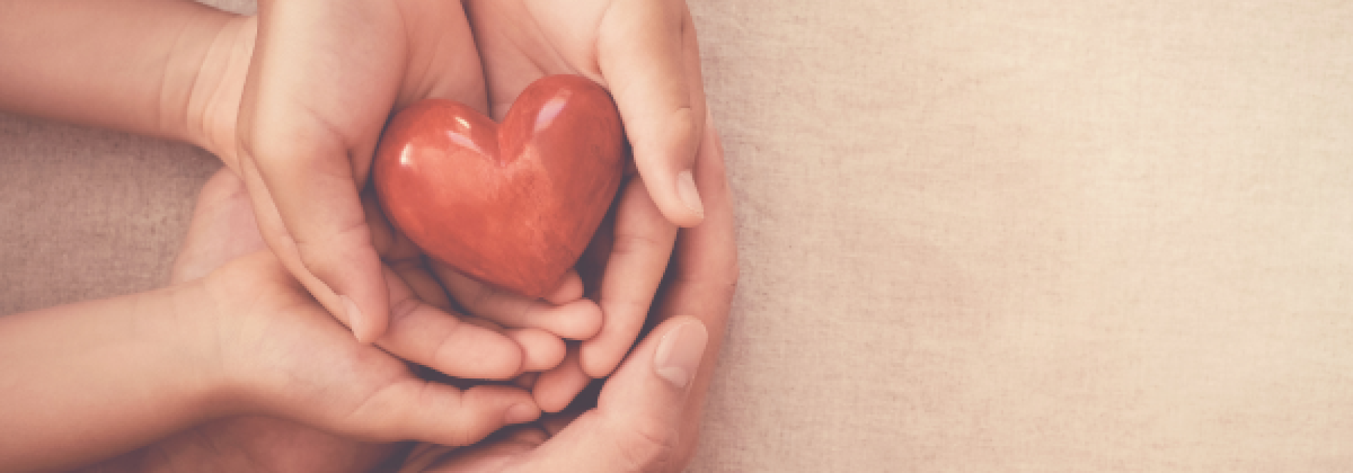 hand hold a glass heart