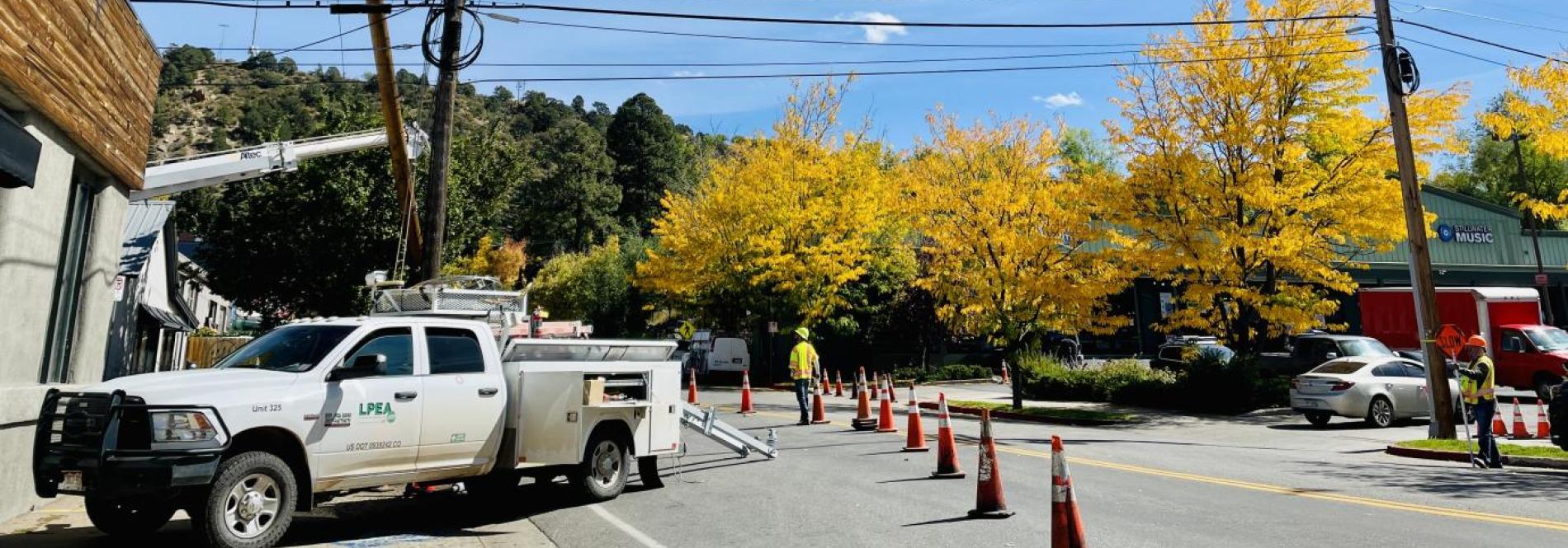 Electric utility truck working in town