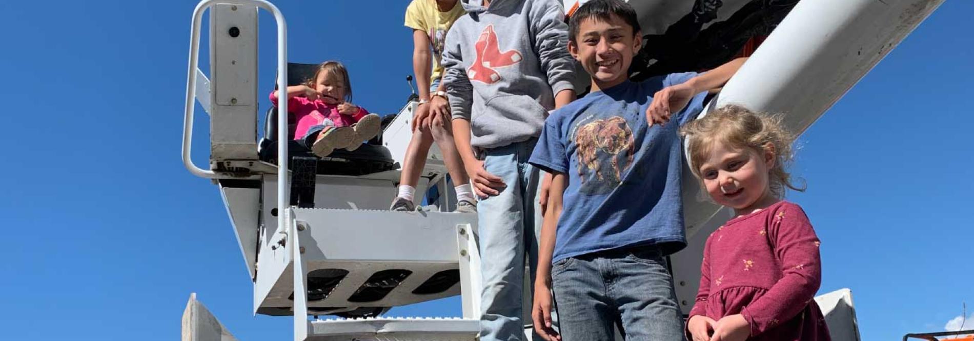 Kids in a bucket truck