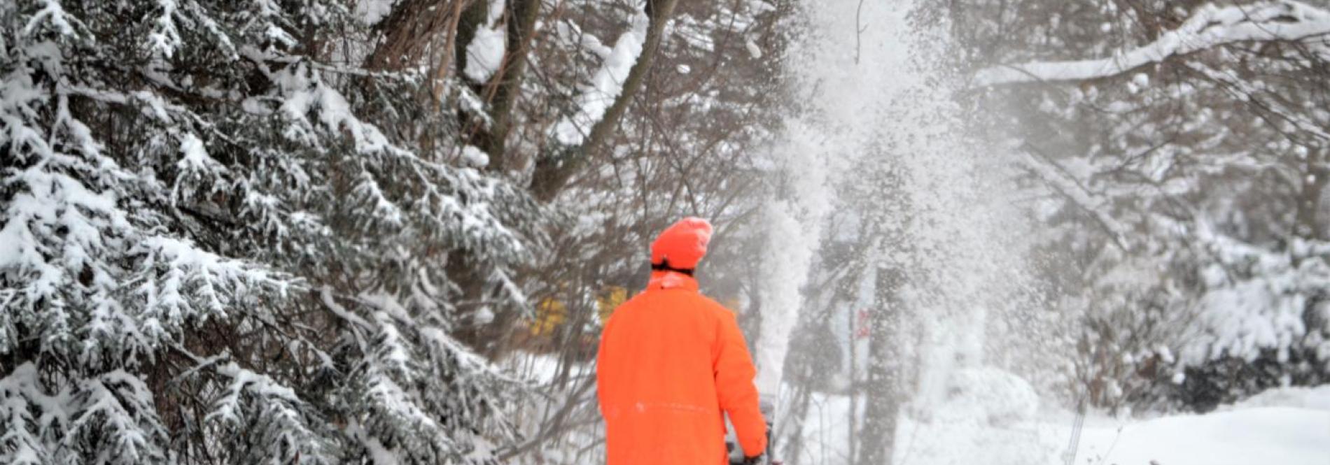 Man using snowblower